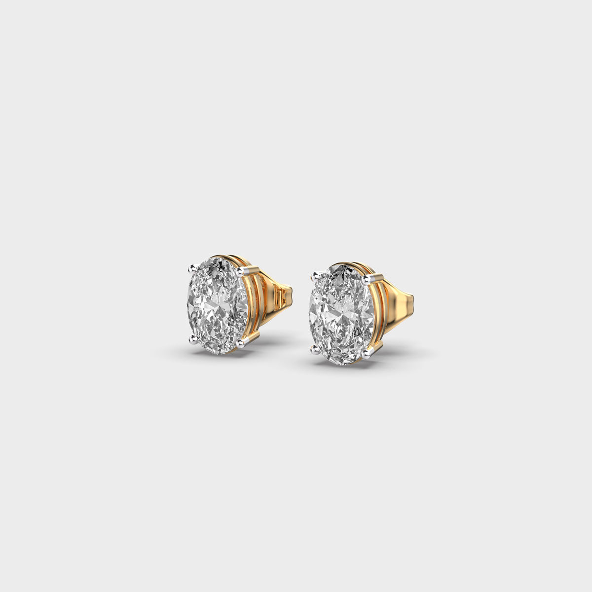 oval diamond 4-prong ear studs