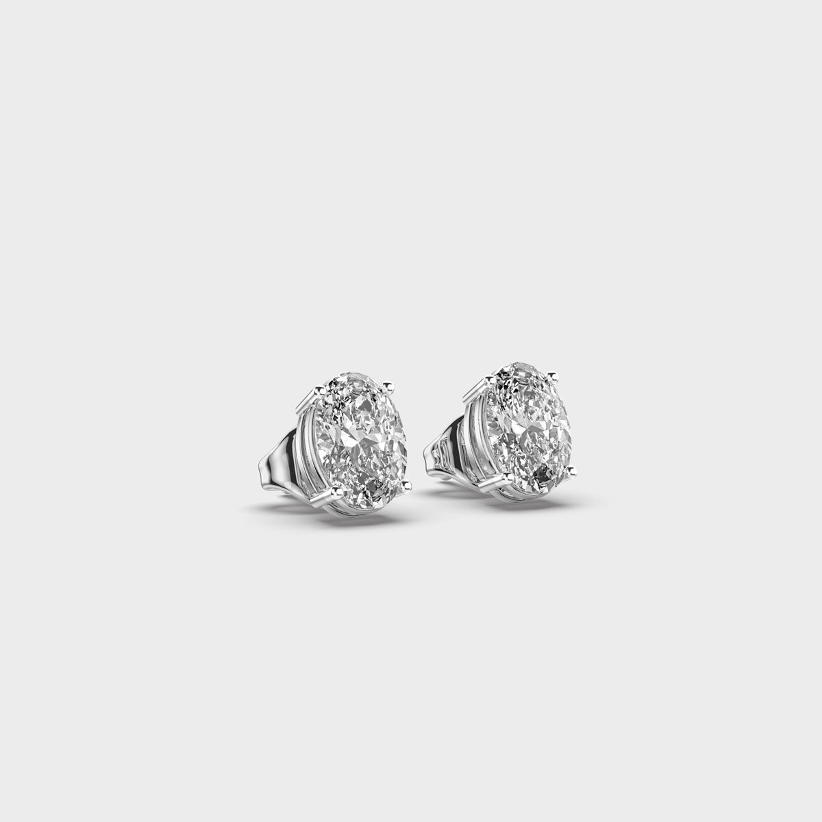 oval diamond 4-prong ear studs
