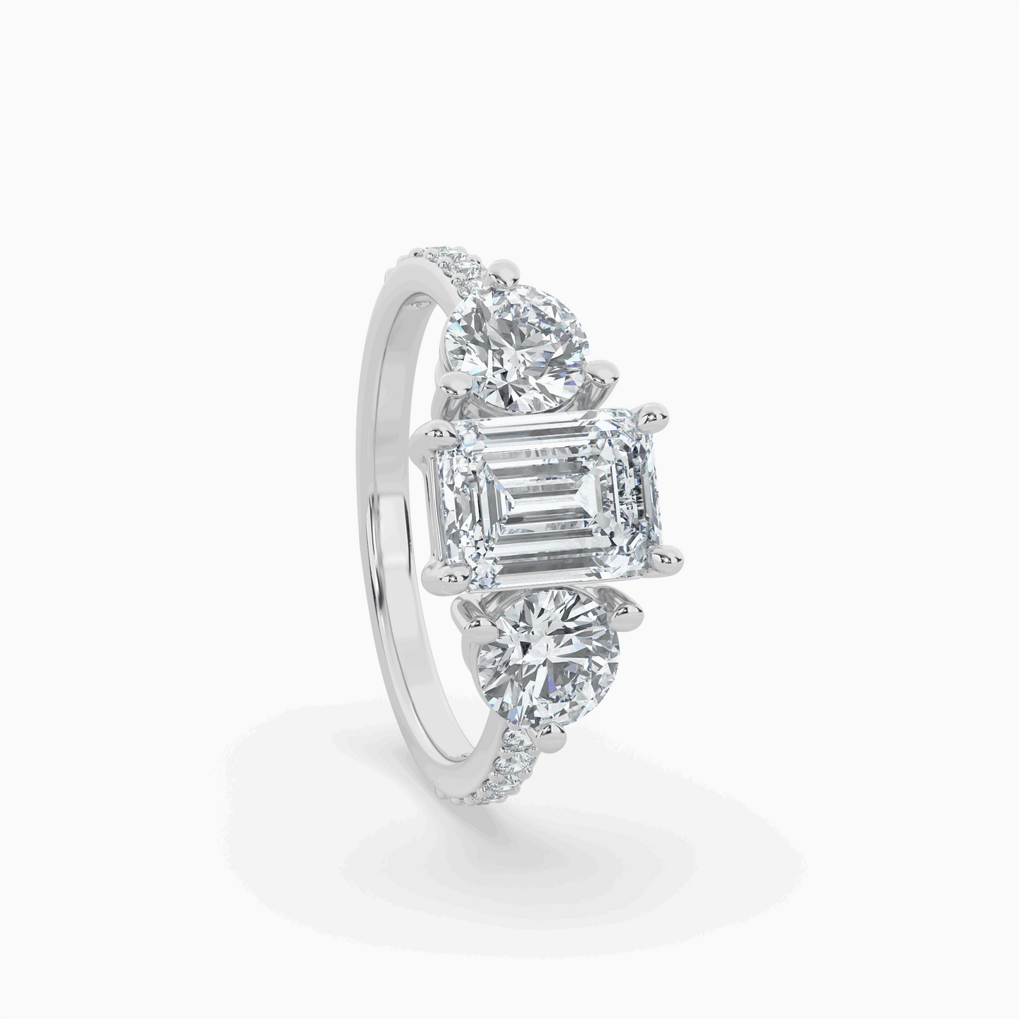 lumina three stone emerald engagement ring