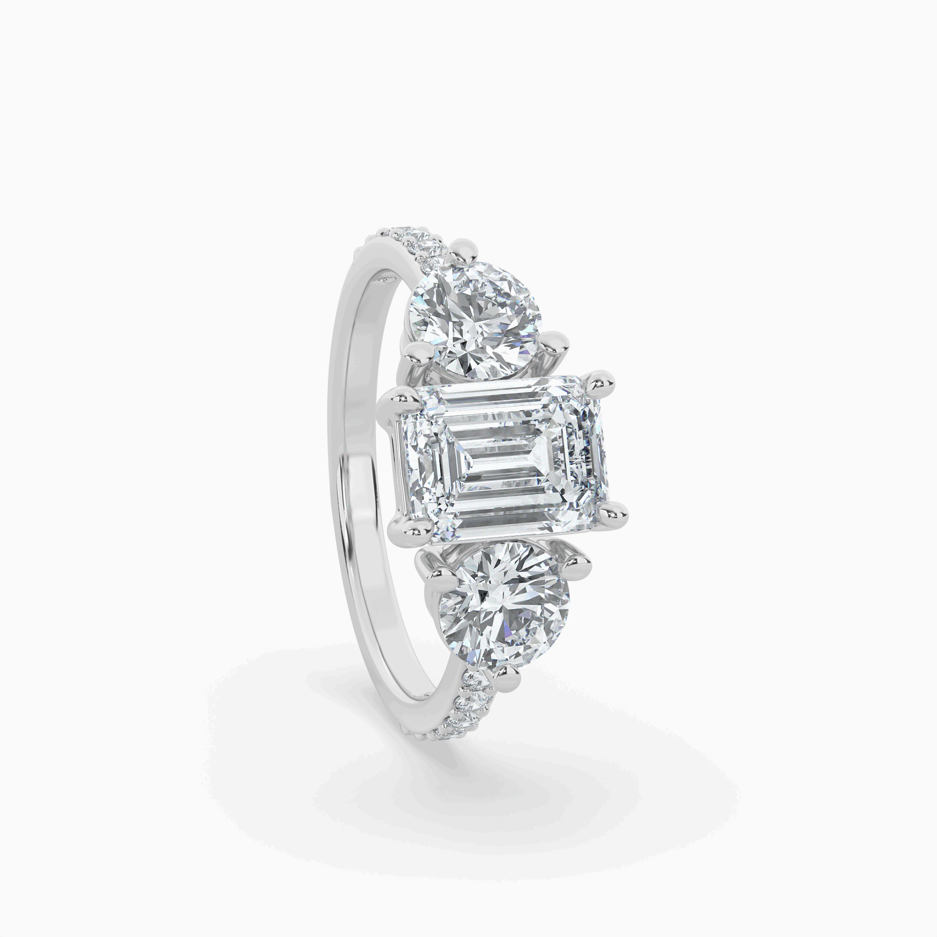 Lumina Three Stone Emerald Engagement Ring