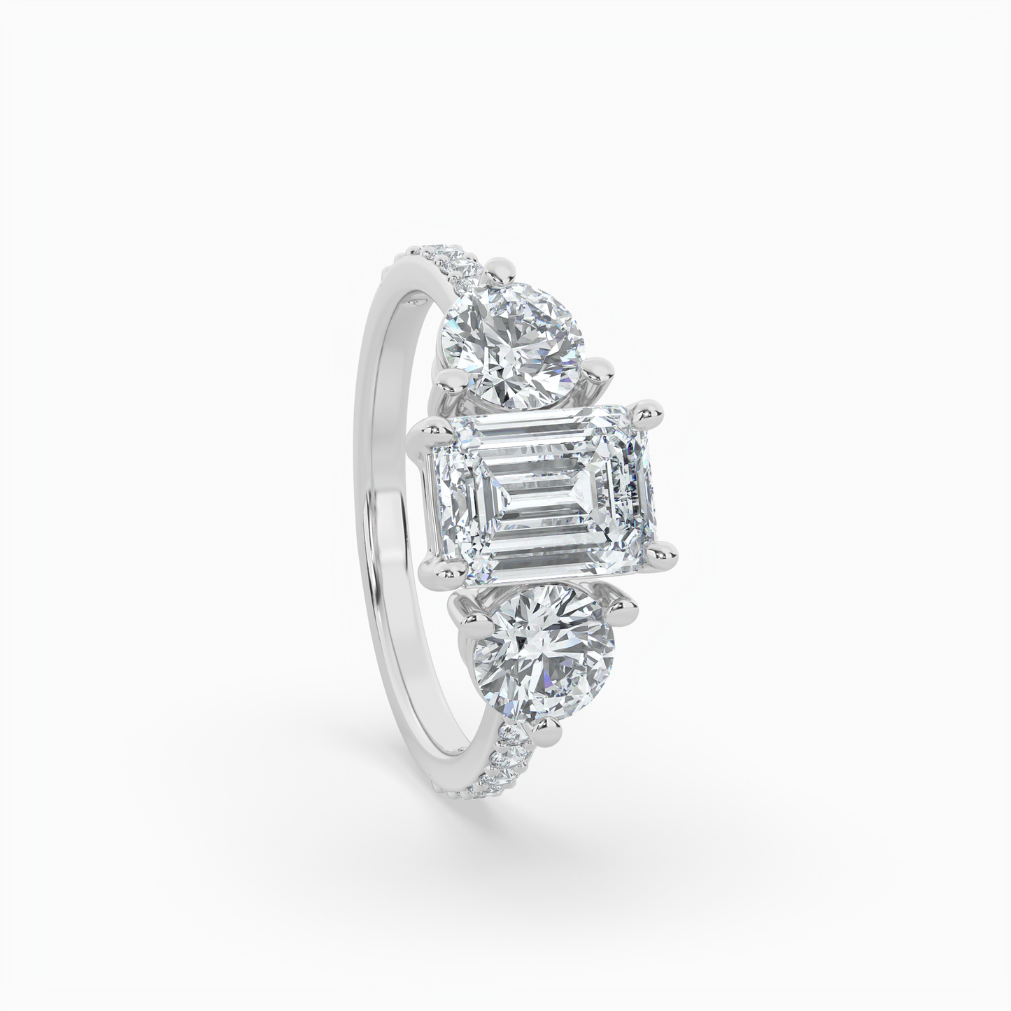 lumina three stone emerald engagement ring