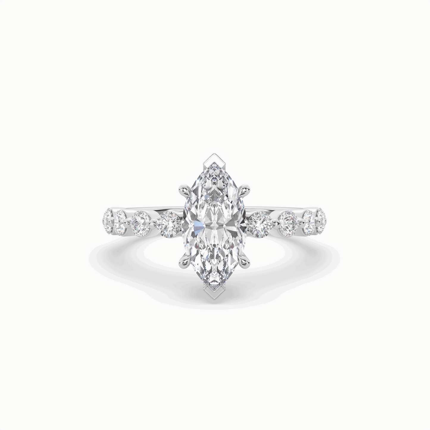 marquise diamond centre and bezel set diamond band engagement ring