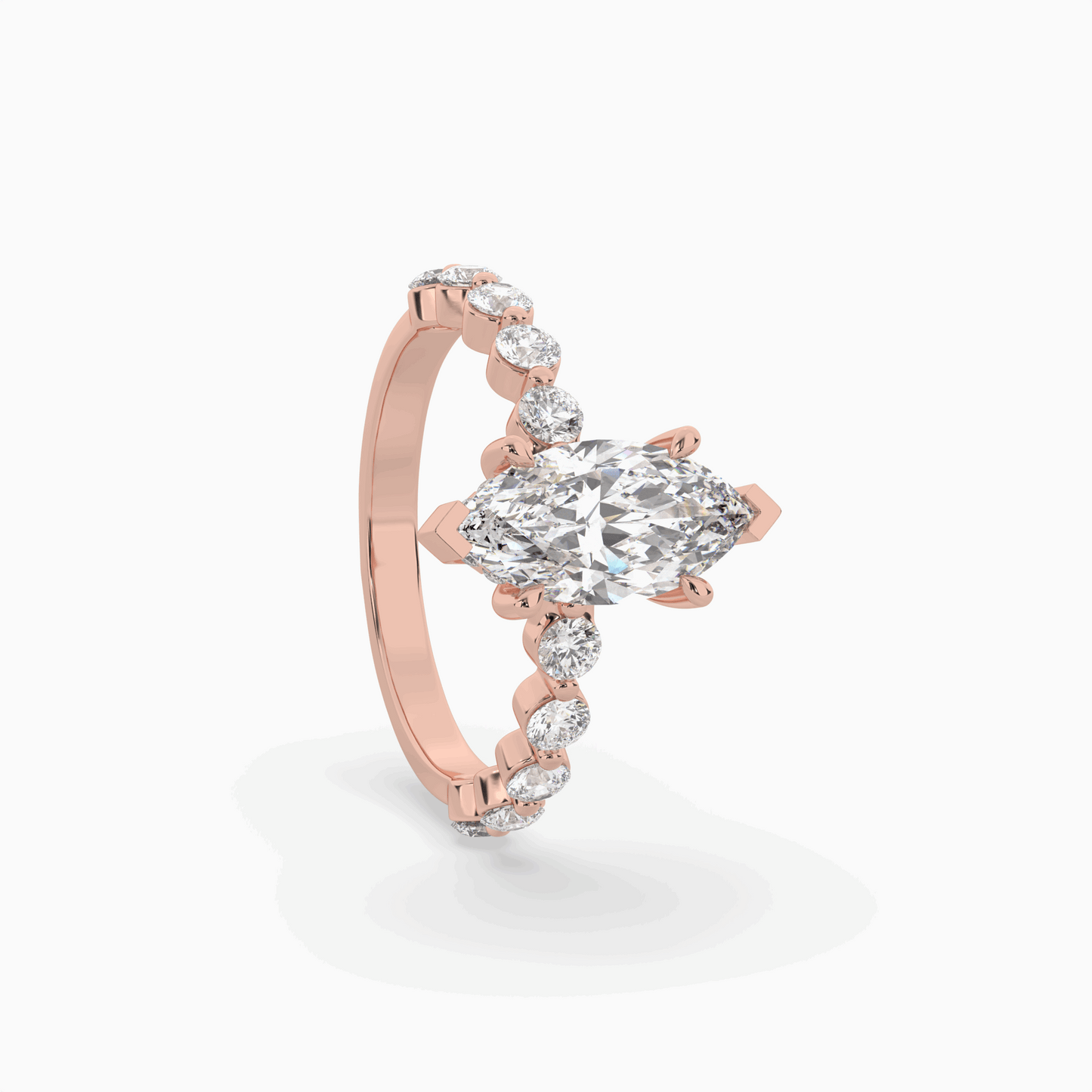 marquise diamond centre and bezel set diamond band engagement ring