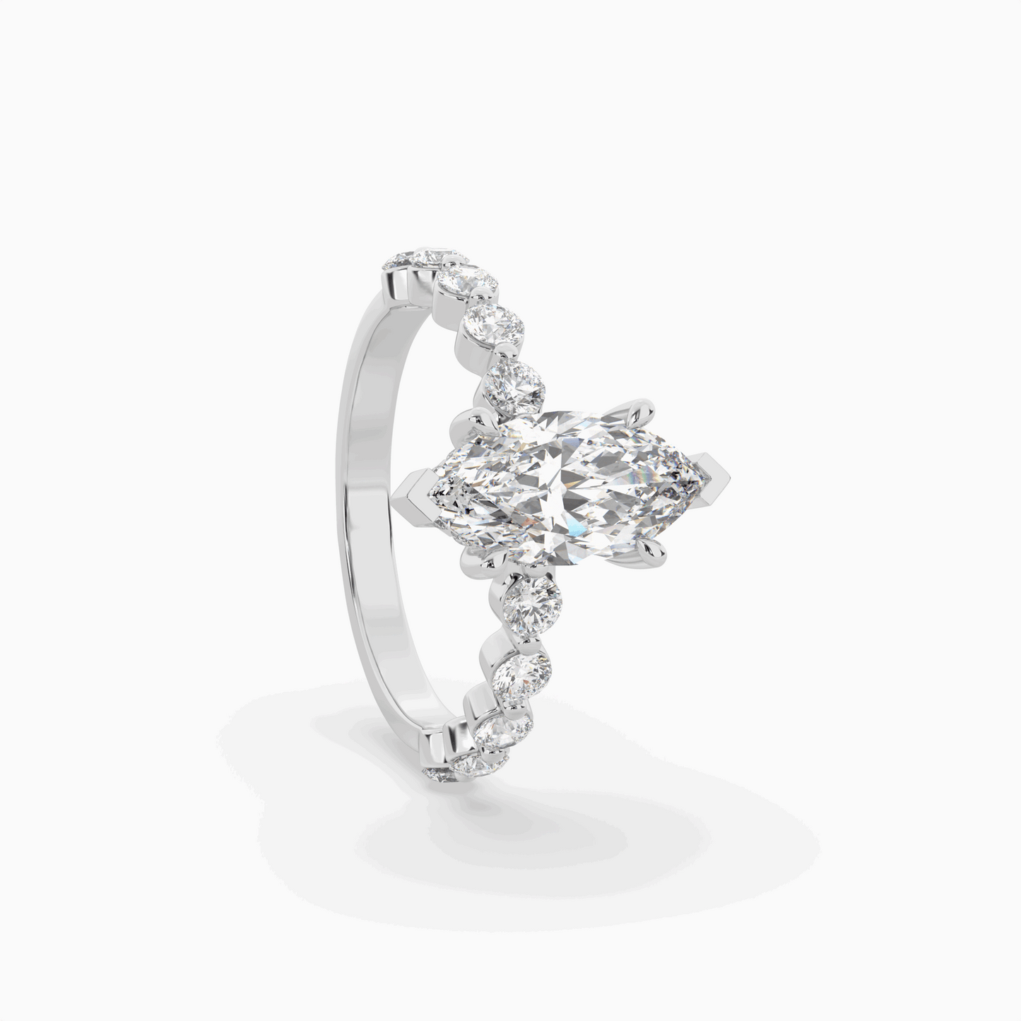 marquise diamond centre and bezel set diamond band engagement ring