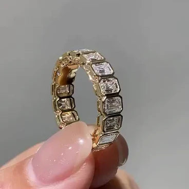 exquisite emrald bezel set eternity ring