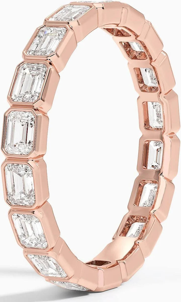 exquisite emrald bezel set eternity ring